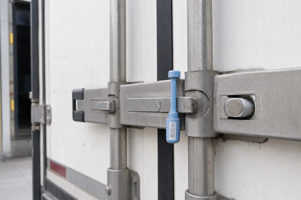 Close-up of a customs seal on a trailer door